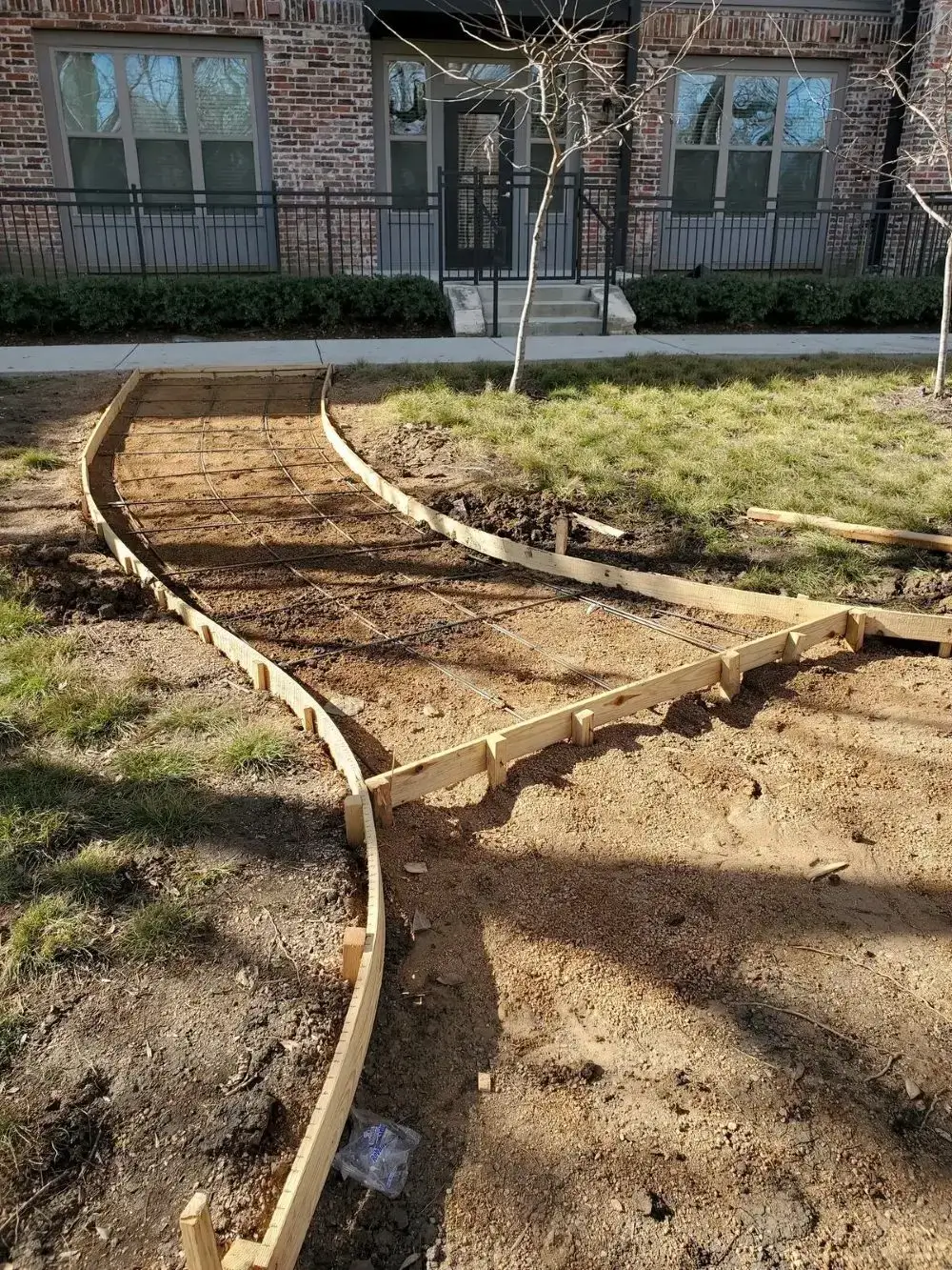 Curved path construction with wooden frames.